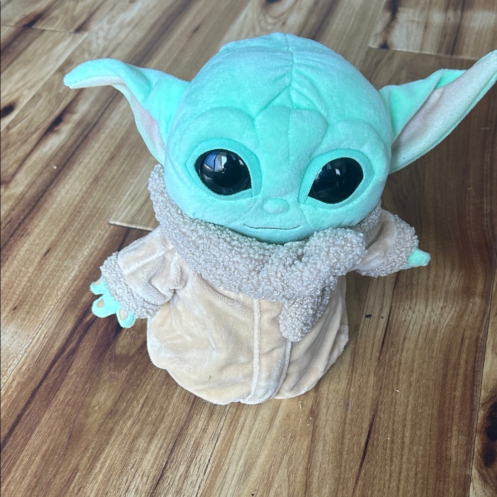 Cuddly Green Alien Plush with Cozy Beige Coat